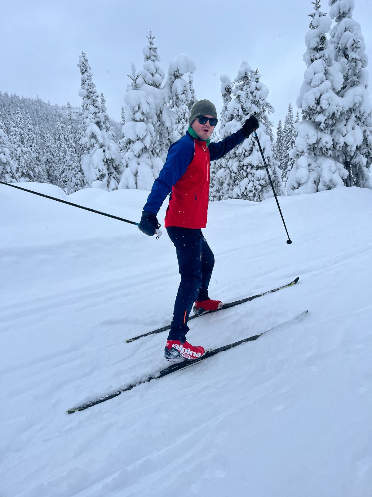 Vegard skiing among snow-covered trees.